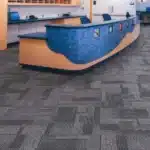Durable grey patterned carpet tiles for modern office reception and commercial flooring in Dubai.