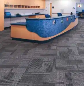 Durable grey patterned carpet tiles for modern office reception and commercial flooring in Dubai. (2) (1)