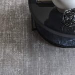 Luxury grey carpet rolls texture for residential and commercial flooring.