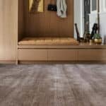 Neutral brown carpet rolls for hallway and entryway flooring.