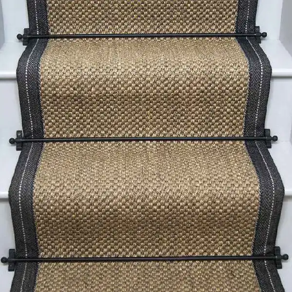 Oriental pewter sisal stair runner with dark grey edging and black stair rods.