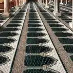 Premium green Firdaus Masjid carpet with traditional Mihrab rows for large Dubai prayer halls.