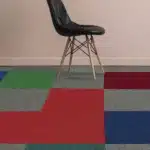 Vibrant multi-colored carpet tiles in red, blue, and green for creative office spaces in Dubai.
