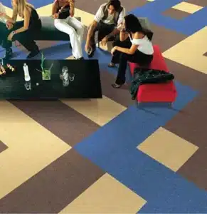 blue, tan, and brown geometric carpet tiles for modern social hubs and office lounges in Dubai.