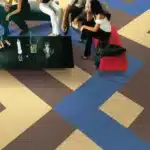 blue, tan, and brown geometric carpet tiles for modern social hubs and office lounges in Dubai.