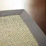cream sisal carpet with a grey cotton border for luxury home flooring and modern villa interiors in Dubai.