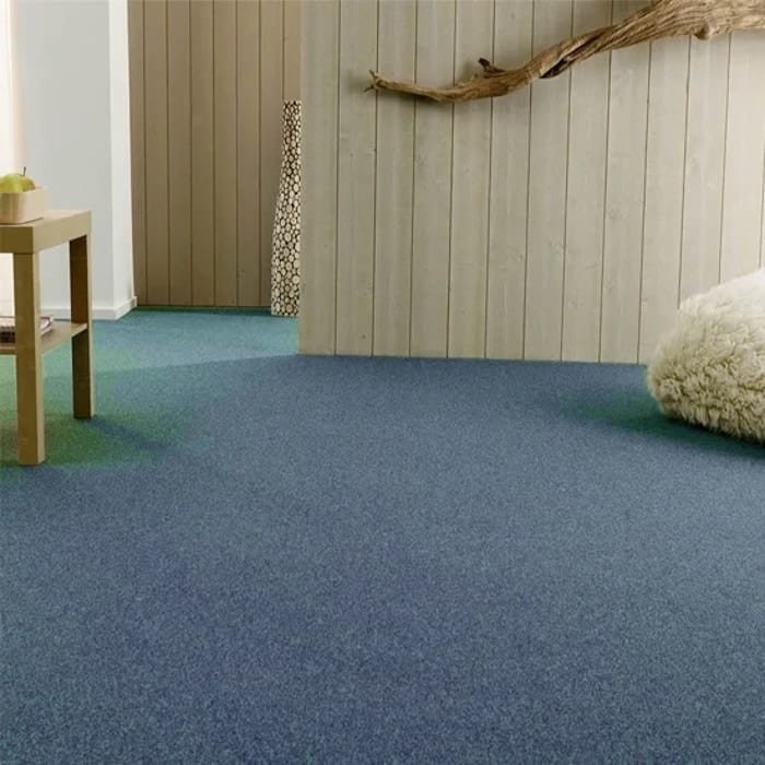 Blue wall to wall carpet in a modern room setting