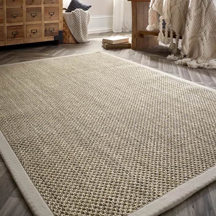 Charcoal grey sisal runner on a wooden staircase