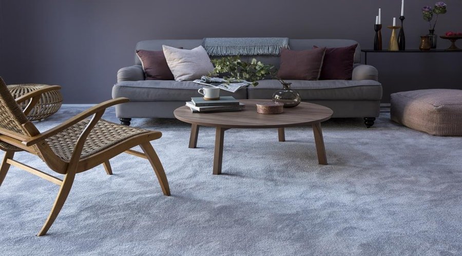 Grey cut pile wall to wall carpet in a modern living room