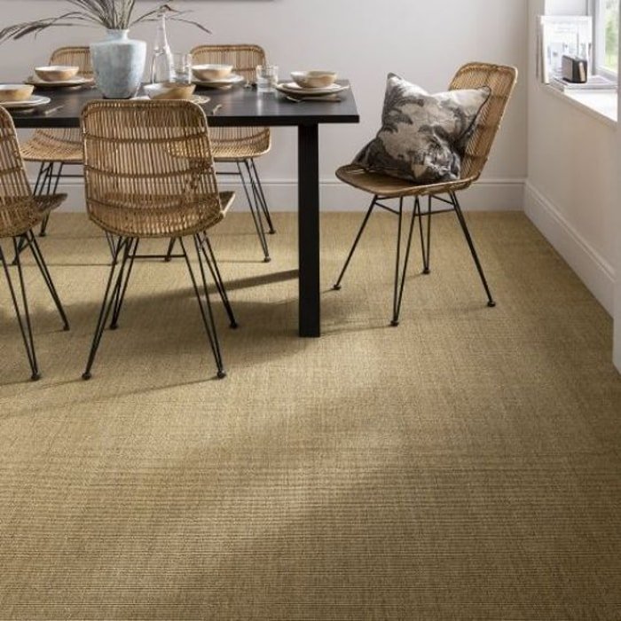 Light beige sisal area rug in a minimalist bedroom