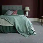 Light-gray-carpet-in-elegant-bedroom-with-teal-bedding