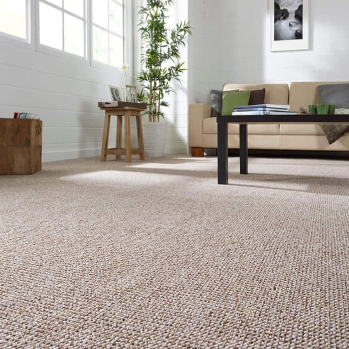 Natural boucle sisal carpet in a bright home office