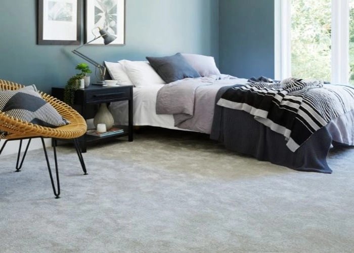 Soft grey silk wall to wall carpet in a bedroom