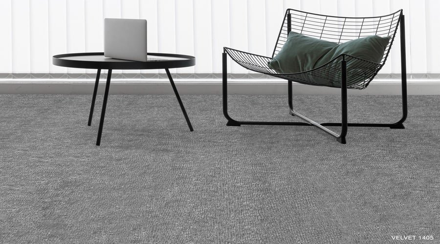 Textured charcoal velvet carpet in a minimalist setup